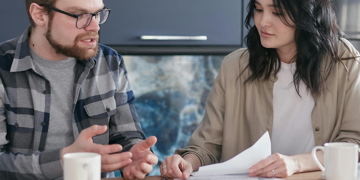 A couple or family discusses long-term wealth and estate planning for their property investments.
