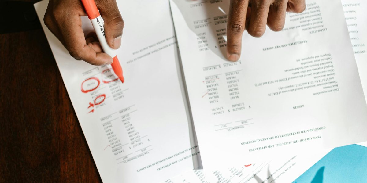 An investor reviews documents related to potential property investments in Dubai.