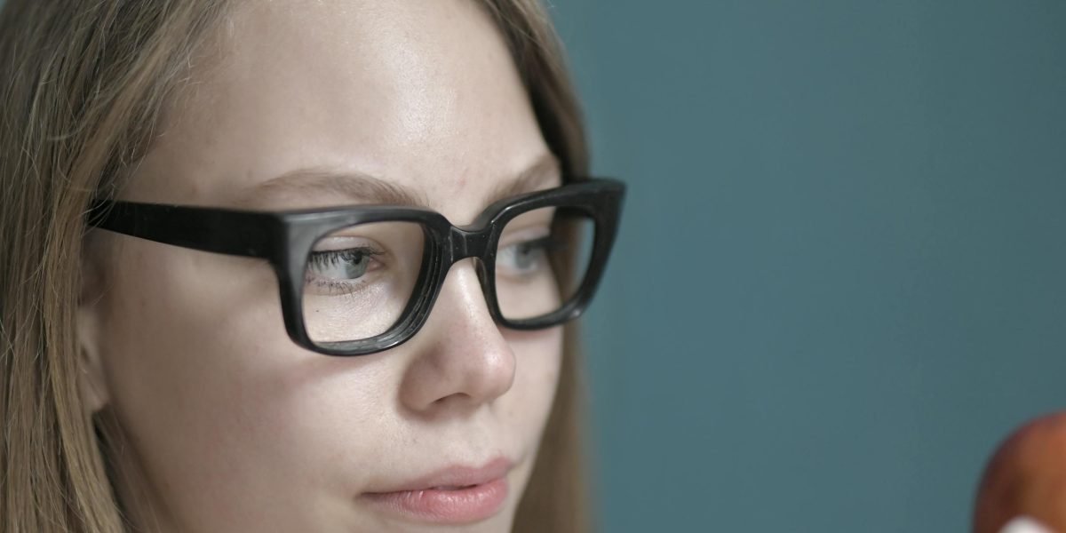 A person thoughtfully considering important choices, reflecting the weight of selecting the right financial guidance.