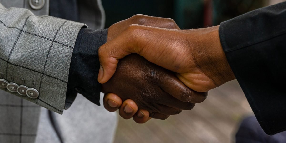 A client and advisor finalizing a detailed services agreement, emphasizing trust and mutual understanding.