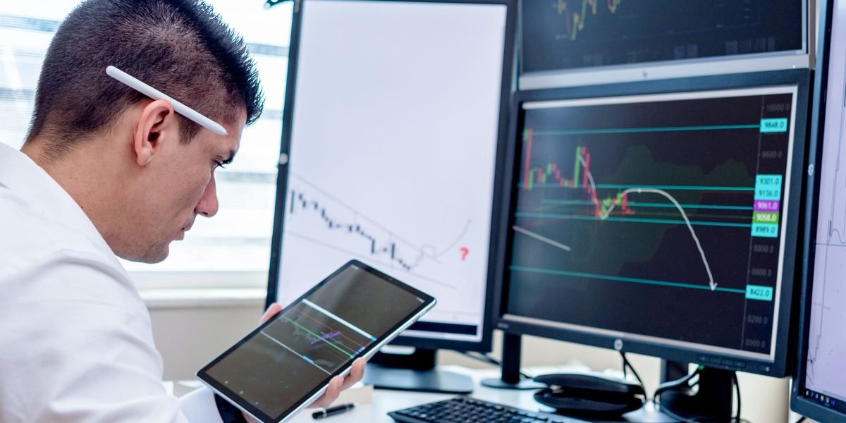 An investor confidently reviewing market trends and data to identify strategic opportunities.