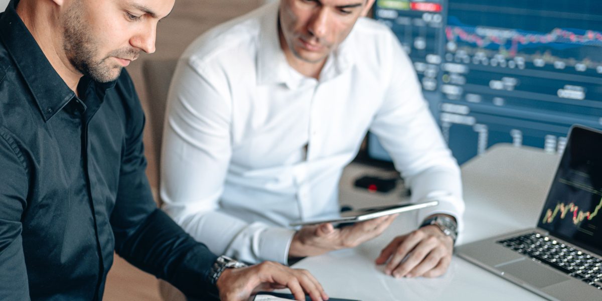 A team collaborating to conduct thorough market research and refine investment strategies.