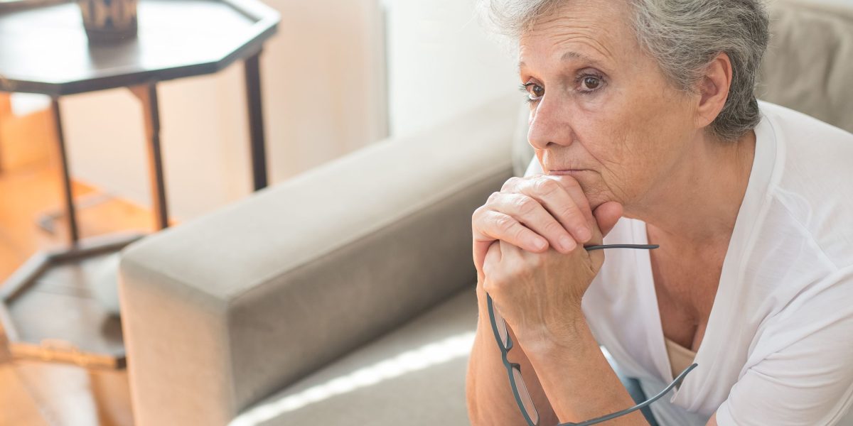 An individual contemplating significant financial decisions for property investment.