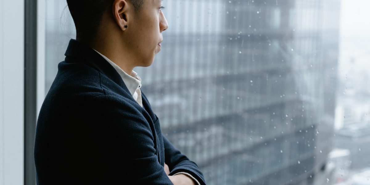 An investor observing a vibrant city skyline, symbolizing potential growth and appreciation of real estate investments.